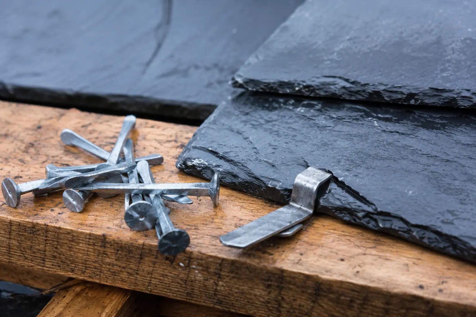 Galvanised slate nails and a slate hook on a batten, the correct fixings for a slate roof