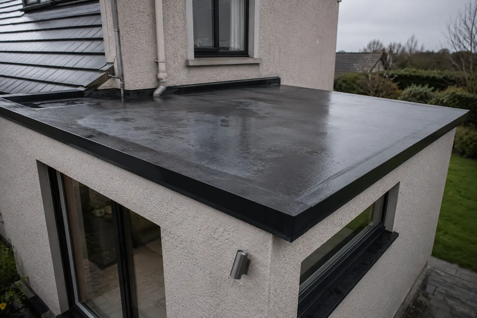 A finished EPDM rubber flat roof on a house extension
