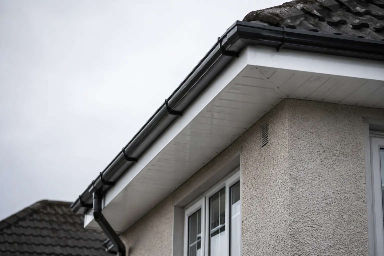 New white uPVC fascia, soffit and guttering along the eaves