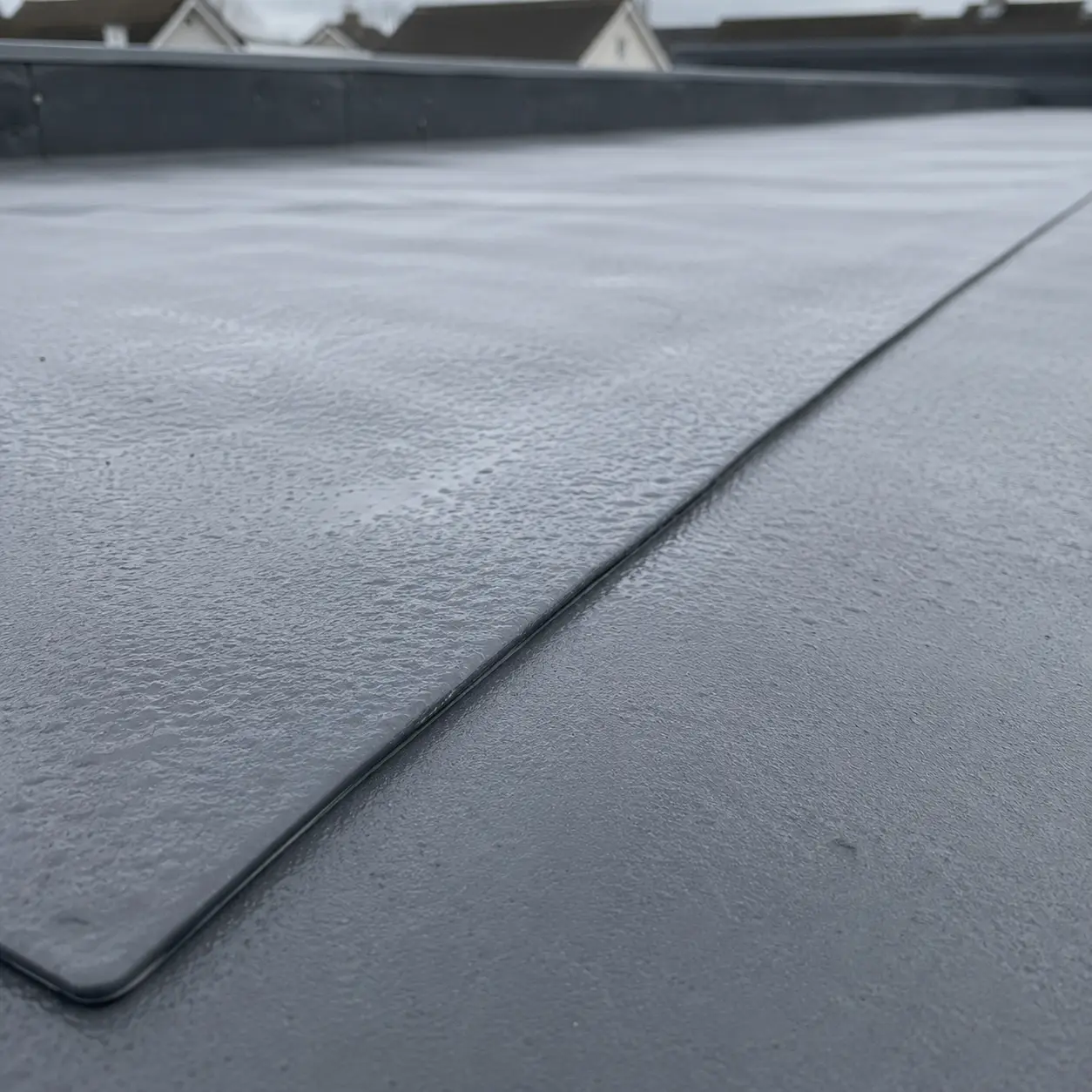 A large commercial flat roof with rooftop plant