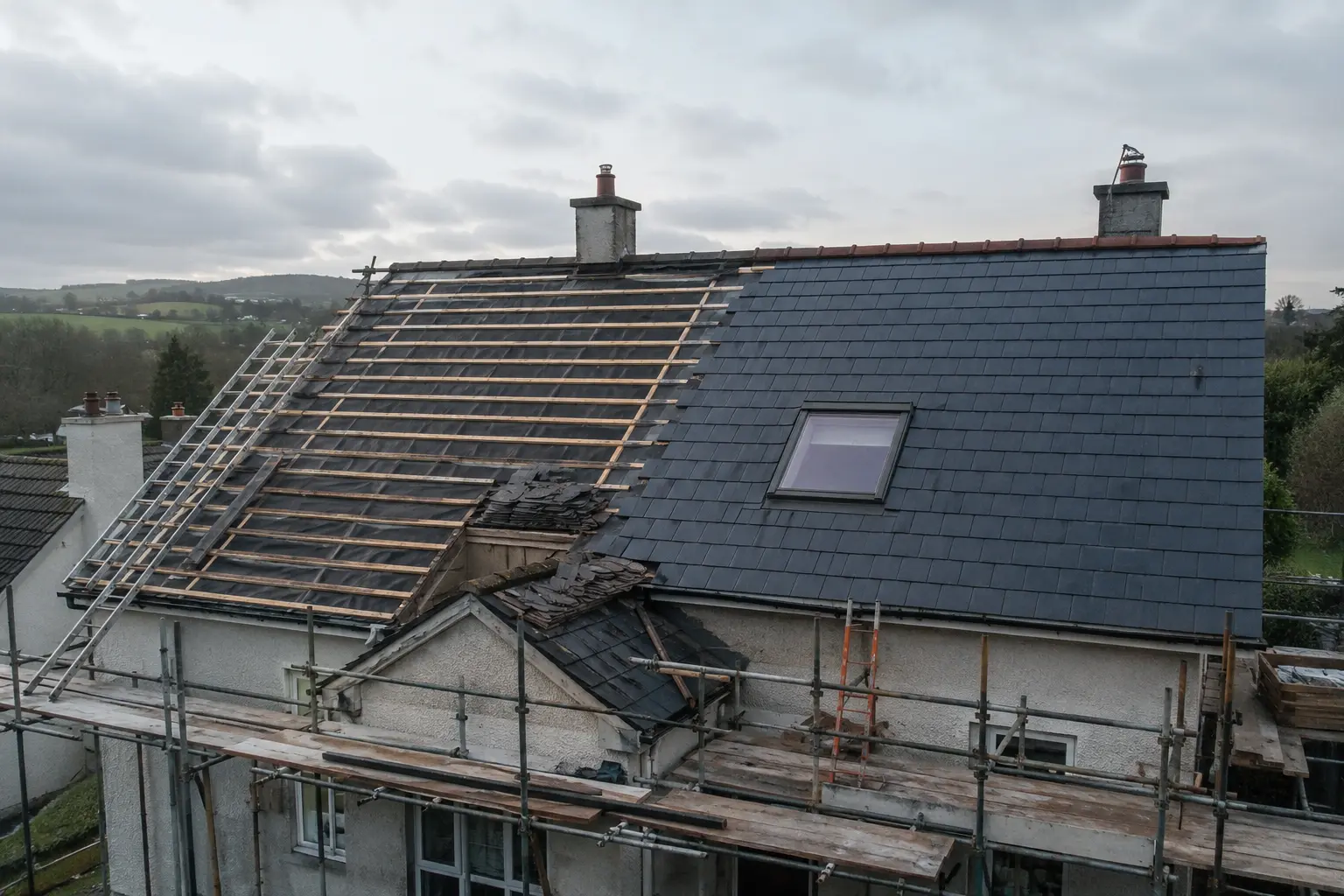 Aged slate roof with slipped and missing slates showing signs it needs replacing