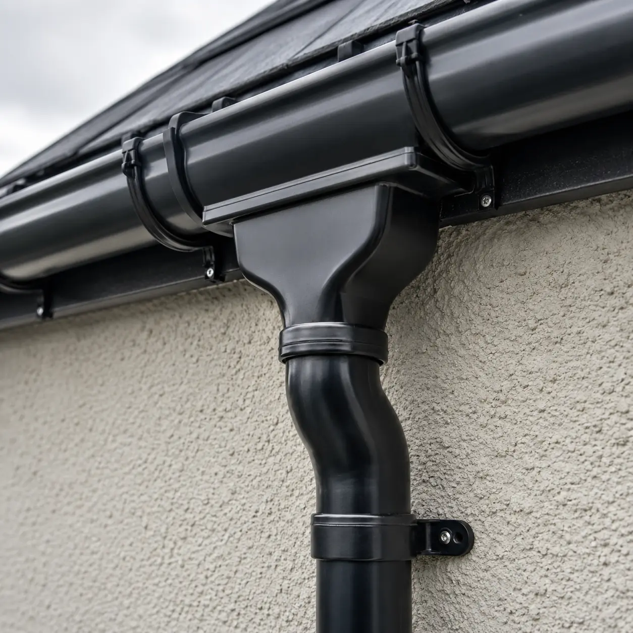 Lead flashing at the base of a brick chimney
